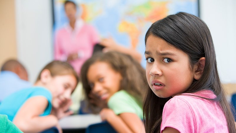 girl being laughed at in the classroom